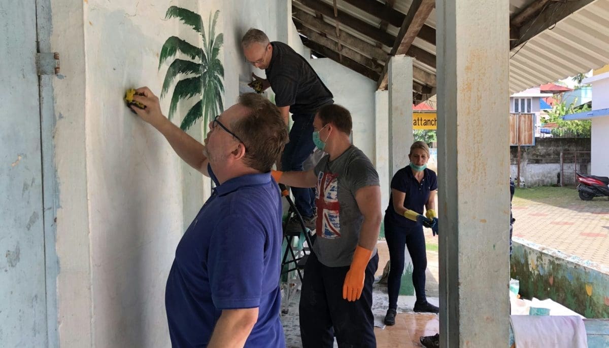 Over 50s volunteers renovating schools