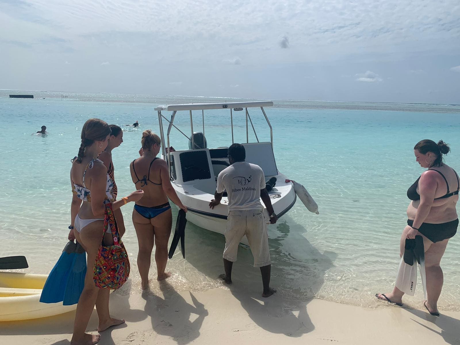 Volunteers hoping on a local boat