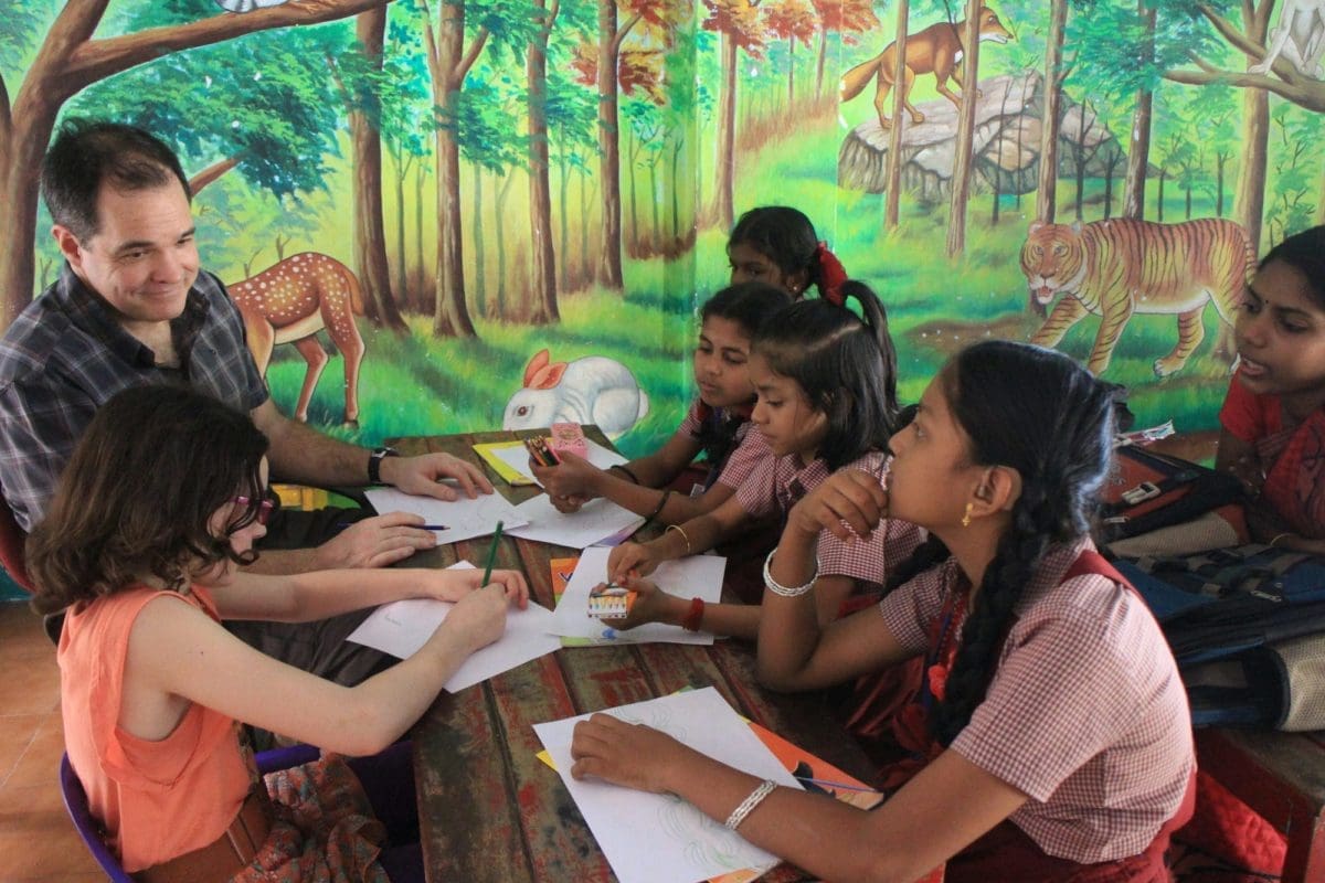 Father and daughter teaching in India